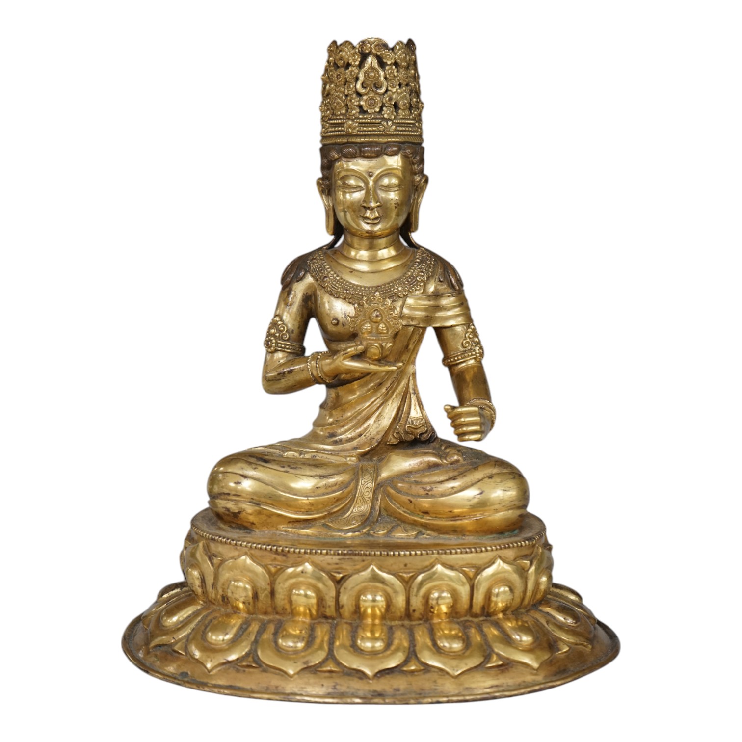 Tibetan School, 20th century gilt bronze figure of a seated deity, 31cm high. Condition - good